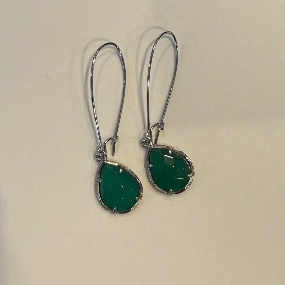 Kendra Scott silver drop pair of earrings with green stone.